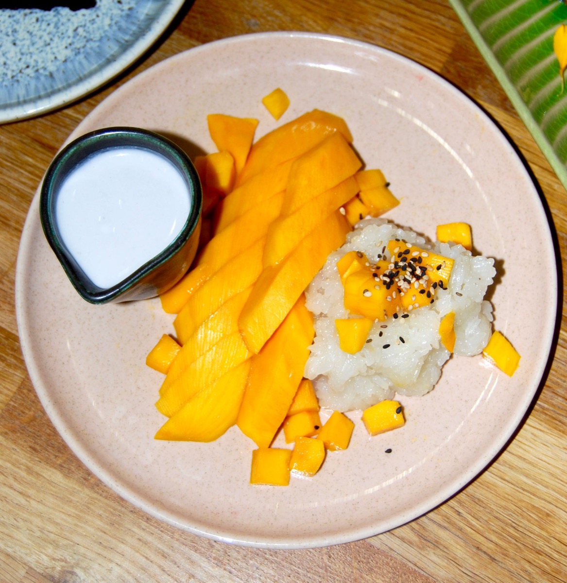 Mango and sticky rice with a jug of warm coconut milk.